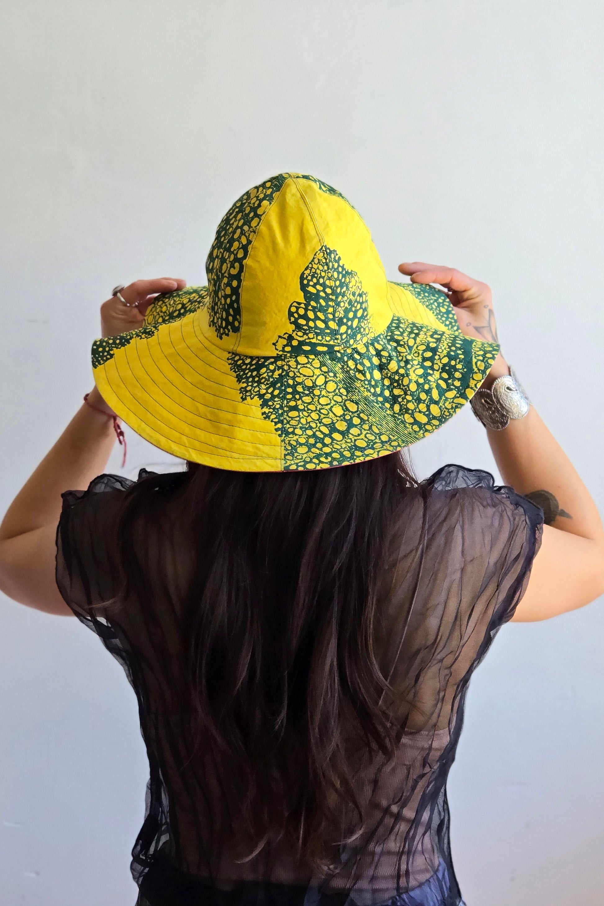 Handcrafted sun hat with a flexible, packable structure and bold fabric prints.