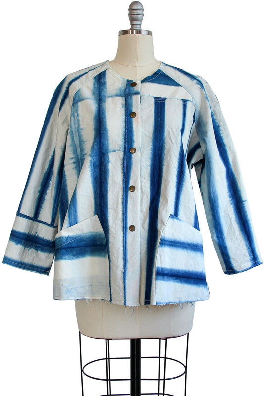 Versatile layering jacket with artisanal dyeing techniques and deep pockets.