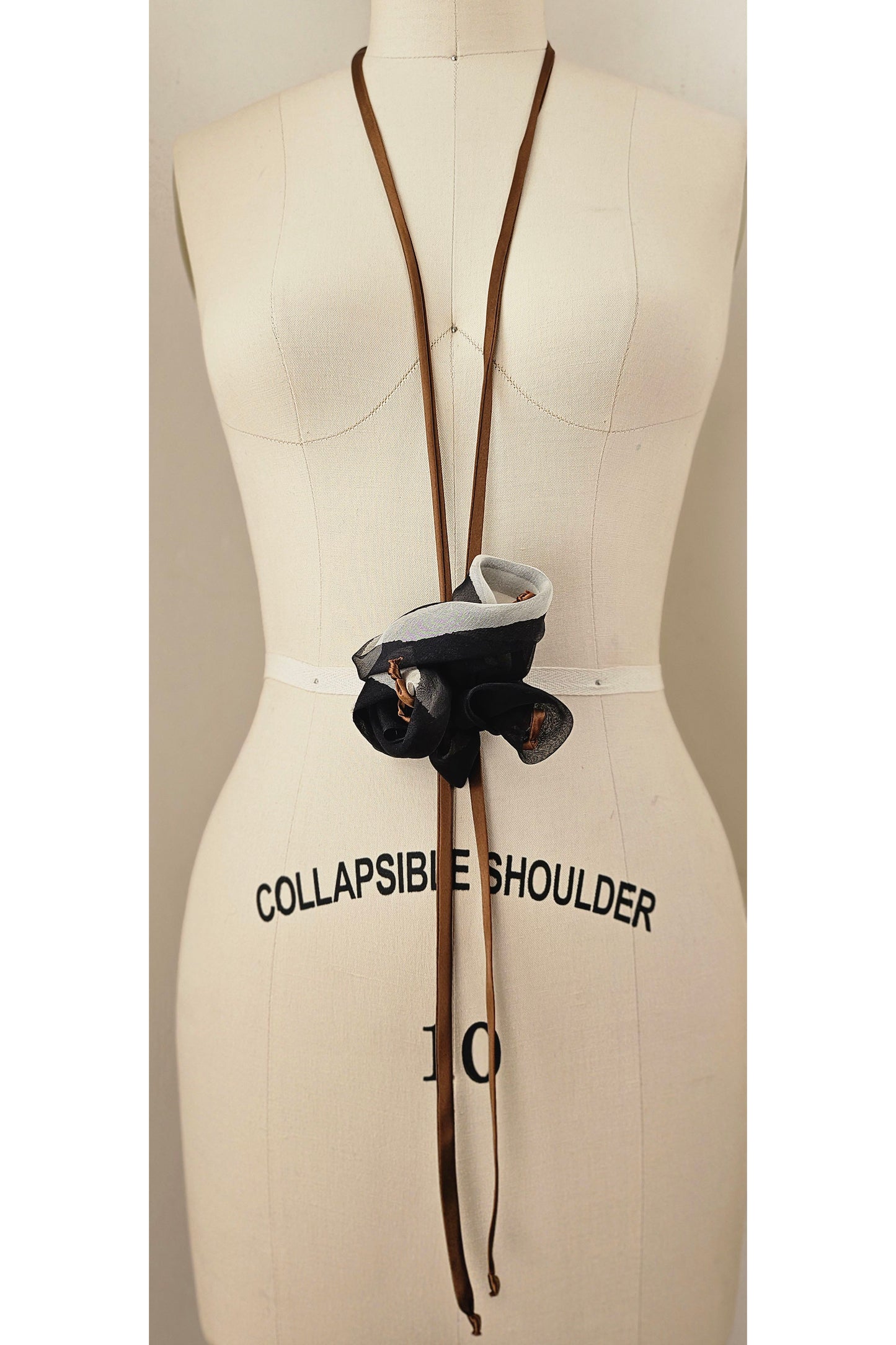 Sustainable silk bolo tie necklace repurposed from garment cuttings.