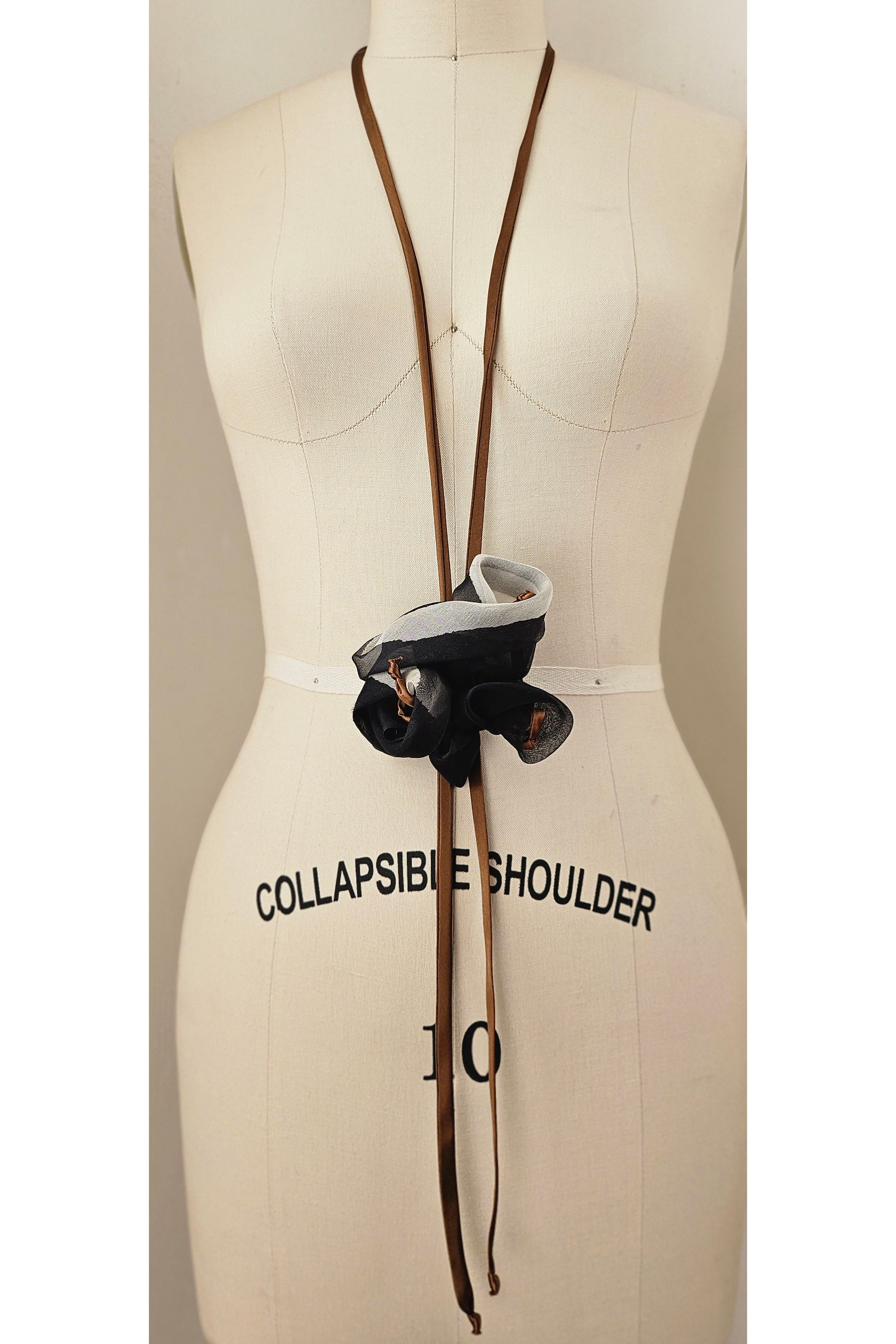 Sustainable silk bolo tie necklace repurposed from garment cuttings.