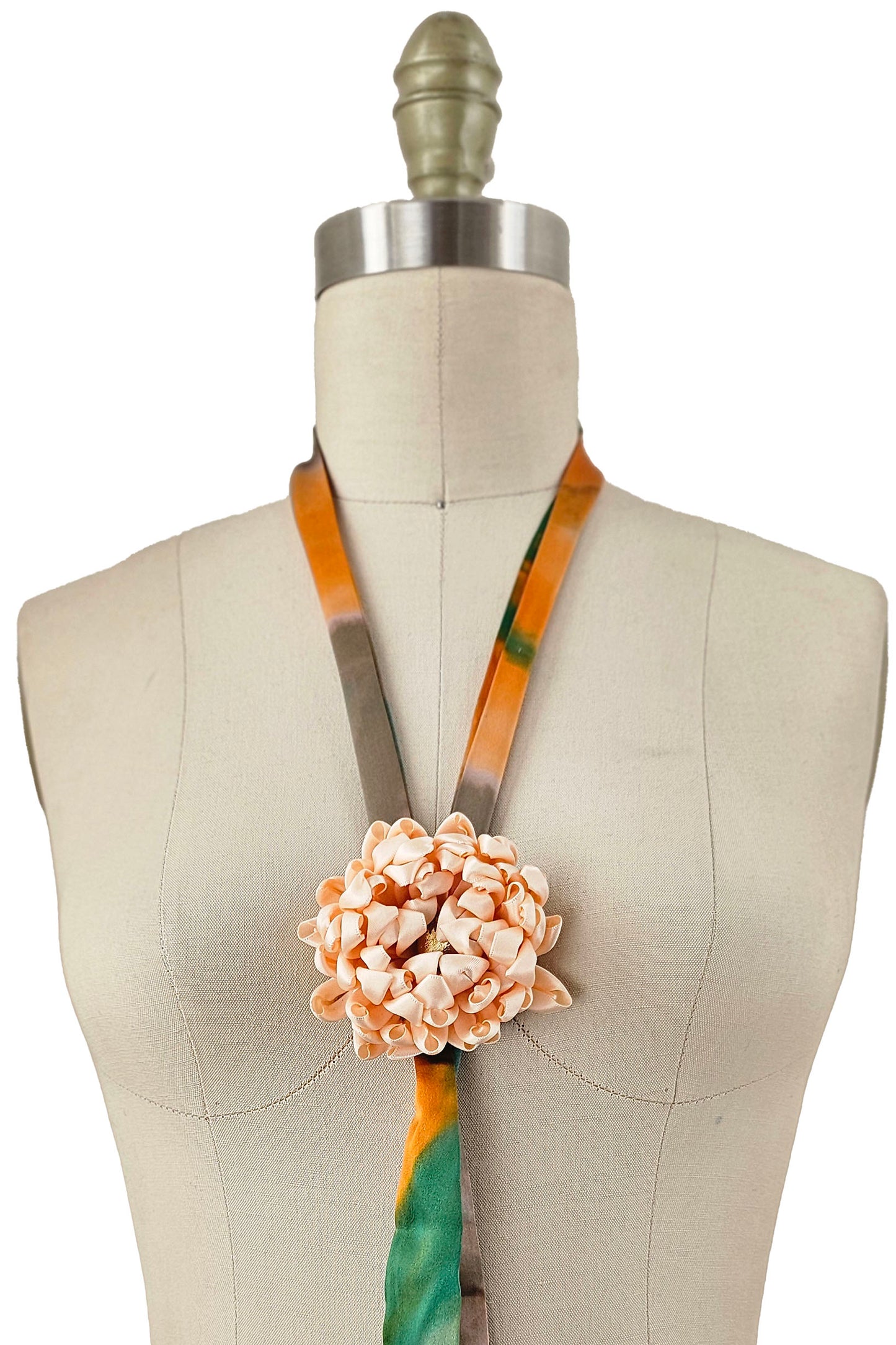 Adriana Handcrafted Silk Bolo Tie Necklace made from fabric remnants with sculpted floral detail.